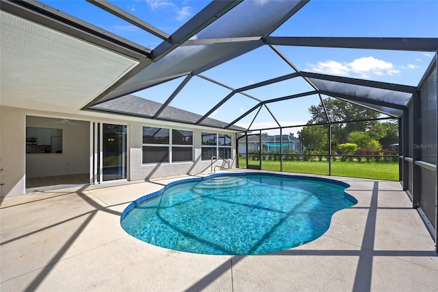 25451 Kowloon Ln, Punta Gorda, FL 33983 - swimming pool featuring a patio, a lawn, and a lanai