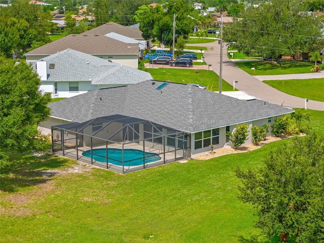25451 Kowloon Ln, Punta Gorda, FL 33983 - outdoor pool featuring a lawn and a lanai