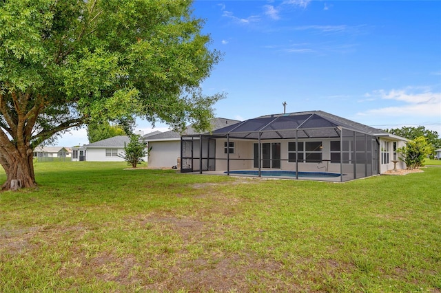 25451 Kowloon Ln, Punta Gorda, FL 33983 - back of house with a yard, an outdoor pool, and a lanai