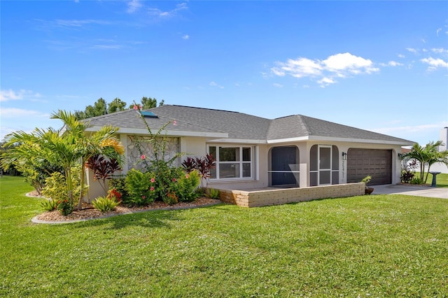 25451 Kowloon Ln, Punta Gorda, FL 33983 - single story home featuring concrete driveway, an attached garage, a front yard, and stucco siding