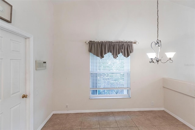 27102 Harbour Oaks Blvd, Punta Gorda, FL 33983 - empty room featuring light tile patterned floors and a chandelier