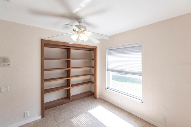 27102 Harbour Oaks Blvd, Punta Gorda, FL 33983 - empty room featuring a ceiling fan and light tile patterned floors