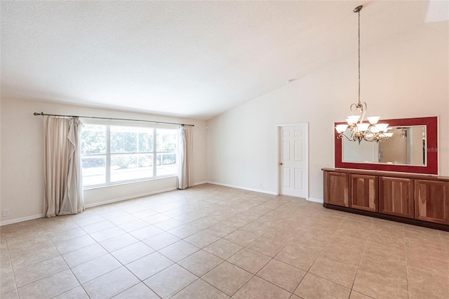 27102 Harbour Oaks Blvd, Punta Gorda, FL 33983 - empty room with a chandelier, light tile patterned floors, and lofted ceiling