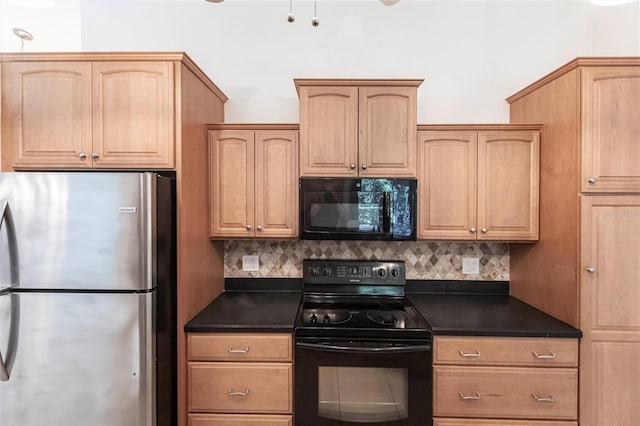 27102 Harbour Oaks Blvd, Punta Gorda, FL 33983 - kitchen featuring black appliances, dark countertops, tasteful backsplash, and light brown cabinetry