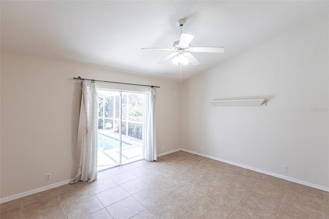 27102 Harbour Oaks Blvd, Punta Gorda, FL 33983 - empty room with ceiling fan, light tile patterned floors, and vaulted ceiling