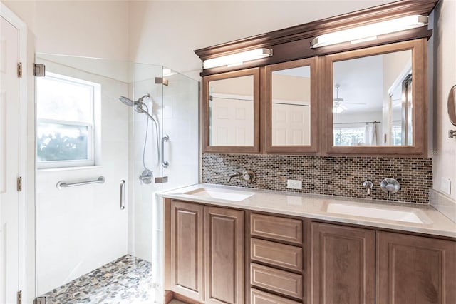 27102 Harbour Oaks Blvd, Punta Gorda, FL 33983 - bathroom with a stall shower, backsplash, ceiling fan, and double vanity