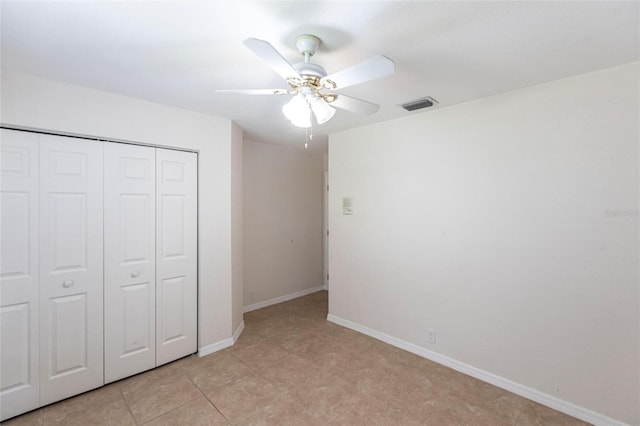 27102 Harbour Oaks Blvd, Punta Gorda, FL 33983 - unfurnished bedroom with a closet, a ceiling fan, and light tile patterned floors