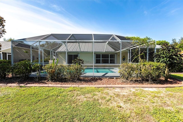 27102 Harbour Oaks Blvd, Punta Gorda, FL 33983 - rear view of house featuring a lawn, an outdoor pool, and a lanai