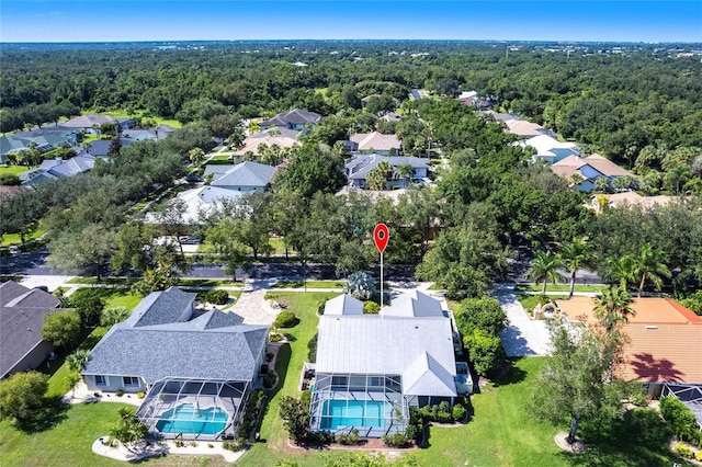 27102 Harbour Oaks Blvd, Punta Gorda, FL 33983 - aerial perspective of suburban area with a pool area and a heavily wooded area
