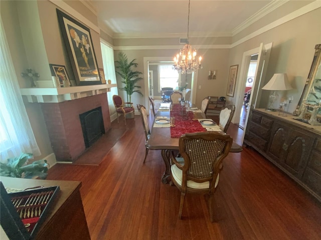 606 E Oak St, Arcadia, FL 34266 - dining space featuring a chandelier, ornamental molding, a fireplace, and dark wood-style floors
