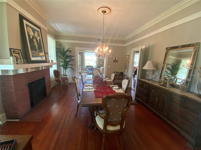 606 E Oak St, Arcadia, FL 34266 - dining room featuring a fireplace, a chandelier, dark wood-type flooring, and ornamental molding
