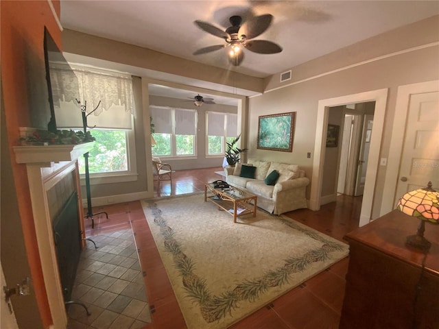 606 E Oak St, Arcadia, FL 34266 - living room featuring ceiling fan, a tile fireplace, and tile patterned flooring