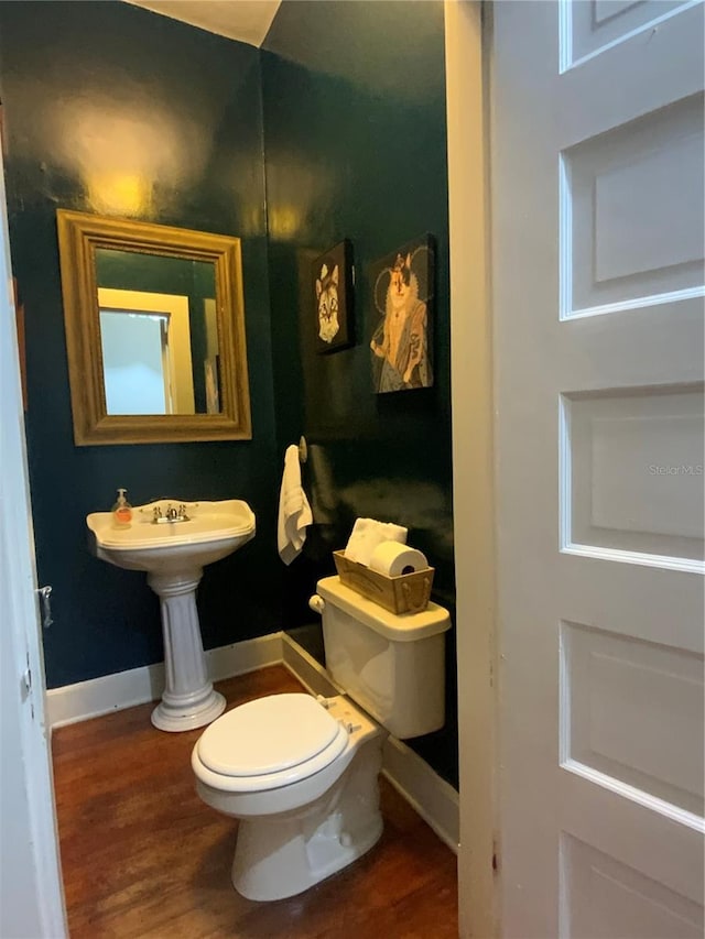 606 E Oak St, Arcadia, FL 34266 - half bath featuring toilet and wood finished floors