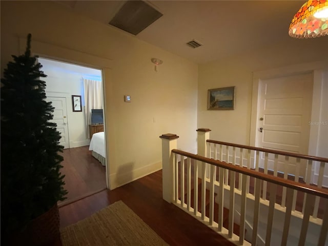 606 E Oak St, Arcadia, FL 34266 - hallway featuring an upstairs landing and dark wood-style flooring