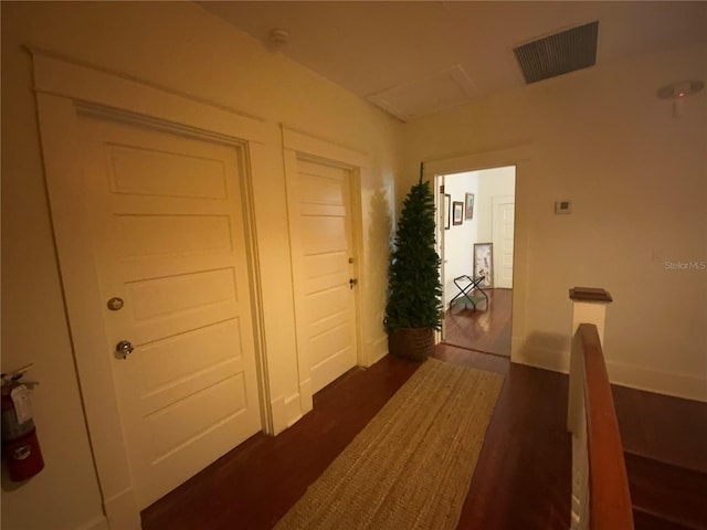 606 E Oak St, Arcadia, FL 34266 - hall with dark wood finished floors and attic access