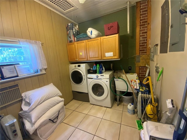 606 E Oak St, Arcadia, FL 34266 - laundry room with cabinet space, electric panel, independent washer and dryer, light tile patterned floors, and wood walls