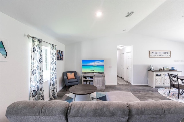 1710 Blackwood Cir, North Port, FL 34288 - living room featuring lofted ceiling and wood finished floors