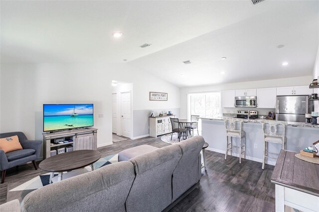 1710 Blackwood Cir, North Port, FL 34288 - living room with vaulted ceiling, dark wood-type flooring, and recessed lighting