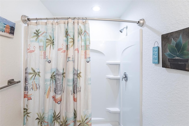 1710 Blackwood Cir, North Port, FL 34288 - full bath with a shower with curtain, a textured wall, and recessed lighting