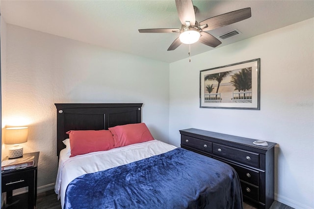 1710 Blackwood Cir, North Port, FL 34288 - bedroom with dark wood-style floors and a ceiling fan