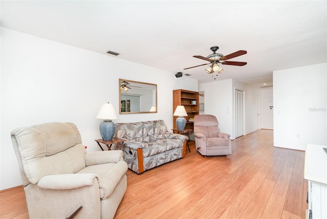 3425 Magnolia Way, Punta Gorda, FL 33950 - living room with a ceiling fan and light wood-style floors