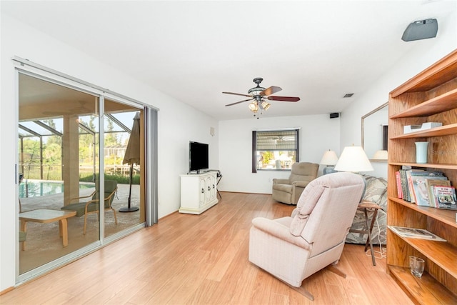 3425 Magnolia Way, Punta Gorda, FL 33950 - living room featuring a ceiling fan and light wood finished floors