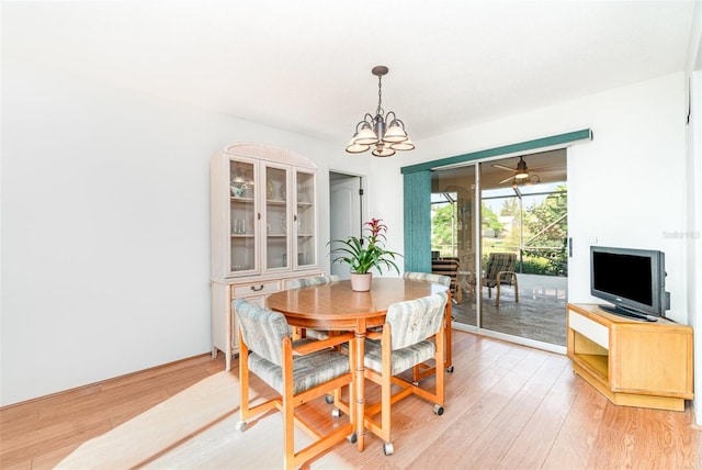 3425 Magnolia Way, Punta Gorda, FL 33950 - dining room with a chandelier and light wood-style floors
