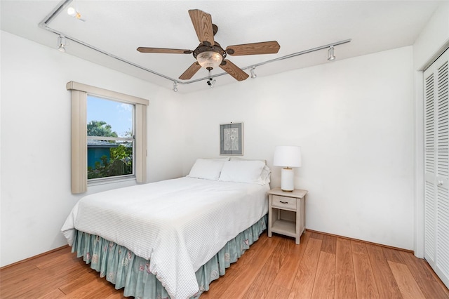 3425 Magnolia Way, Punta Gorda, FL 33950 - bedroom with track lighting, a closet, and wood finished floors