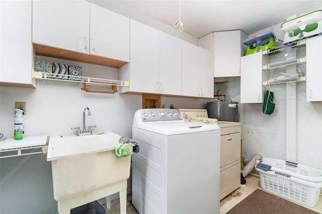 3425 Magnolia Way, Punta Gorda, FL 33950 - washroom with washer and clothes dryer, water heater, and cabinet space