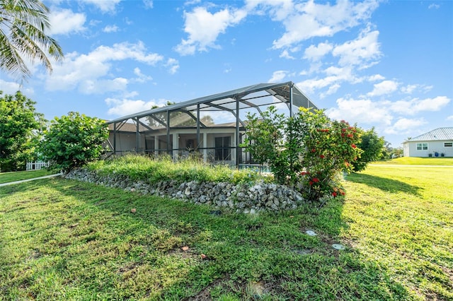 3425 Magnolia Way, Punta Gorda, FL 33950 - rear view of property featuring a lawn and a lanai