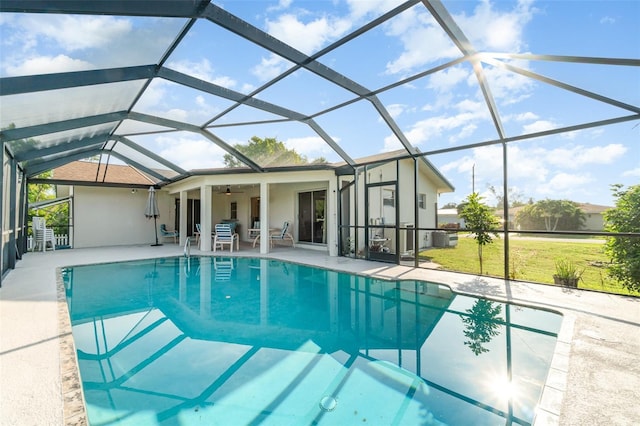 3425 Magnolia Way, Punta Gorda, FL 33950 - outdoor pool with a patio, ceiling fan, a lawn, and a lanai