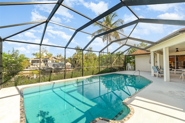 3425 Magnolia Way, Punta Gorda, FL 33950 - outdoor pool featuring a patio, a ceiling fan, and glass enclosure