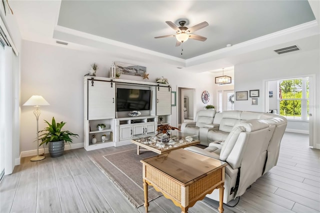 13416 Trascoro Ln, Port Charlotte, FL 33981 - living area with a raised ceiling, a ceiling fan, wood finish floors, and ornamental molding
