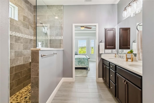 13416 Trascoro Ln, Port Charlotte, FL 33981 - full bathroom with double vanity, ensuite bathroom, walk in shower, and a ceiling fan