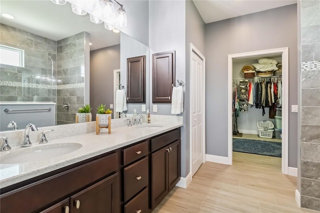 13416 Trascoro Ln, Port Charlotte, FL 33981 - full bathroom featuring double vanity, a walk in shower, and a spacious closet