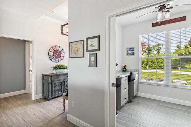 13416 Trascoro Ln, Port Charlotte, FL 33981 - corridor featuring light wood-style floors and an office area