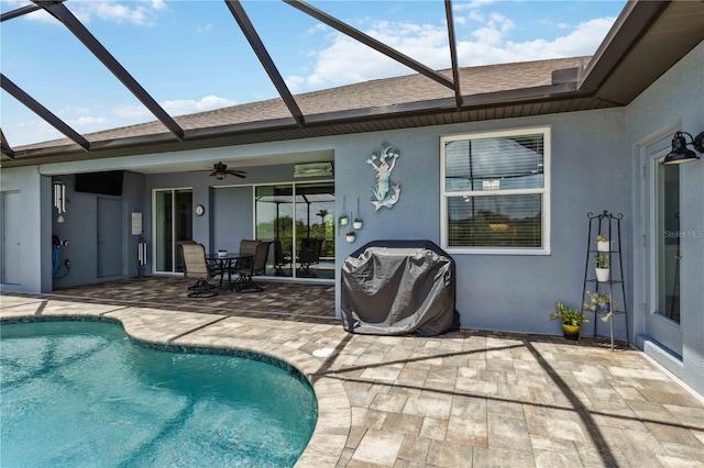 13416 Trascoro Ln, Port Charlotte, FL 33981 - outdoor pool with a patio, grilling area, a ceiling fan, and glass enclosure
