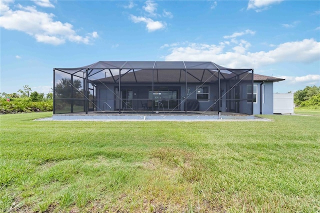 13416 Trascoro Ln, Port Charlotte, FL 33981 - rear view of house featuring a lawn, a lanai, and stucco siding