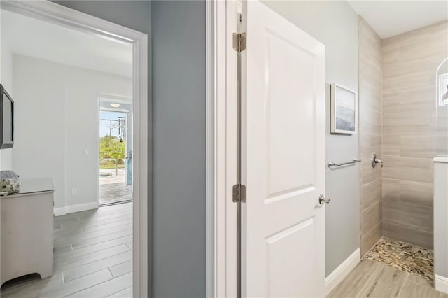 13416 Trascoro Ln, Port Charlotte, FL 33981 - hallway with light wood-style floors and baseboards