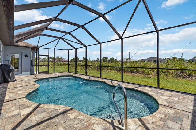 13416 Trascoro Ln, Port Charlotte, FL 33981 - swimming pool with a patio, a lawn, and a lanai