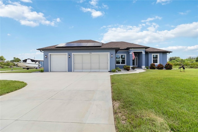 13416 Trascoro Ln, Port Charlotte, FL 33981 - view of front facade with driveway, stucco siding, a garage, a front yard, and solar panels