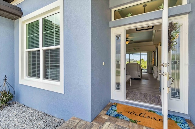 13416 Trascoro Ln, Port Charlotte, FL 33981 - doorway to property featuring stucco siding and french doors
