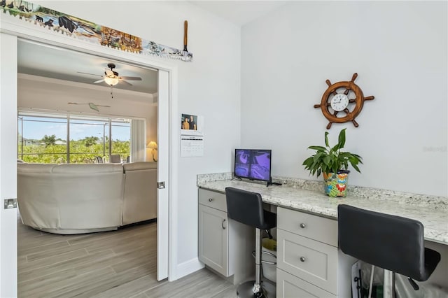 13416 Trascoro Ln, Port Charlotte, FL 33981 - office with built in study area, ceiling fan, and light wood finished floors