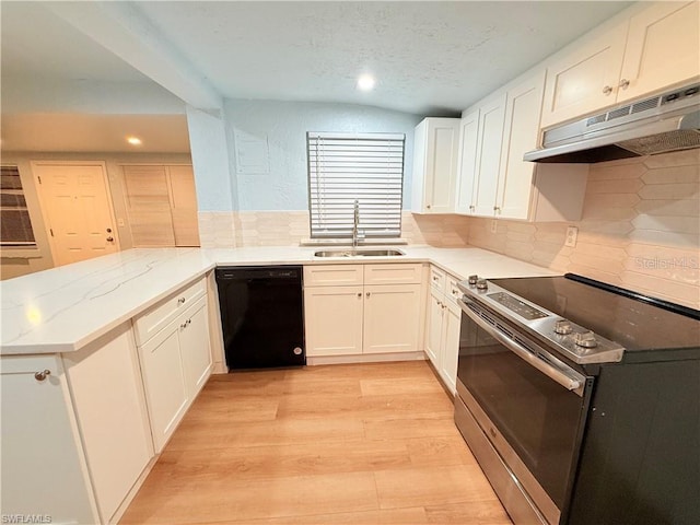 3902 Locust Ave, Sarasota, FL 34234 - kitchen with black dishwasher, stainless steel electric range oven, under cabinet range hood, a peninsula, and recessed lighting