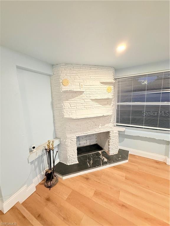 3902 Locust Ave, Sarasota, FL 34234 - detailed view of wood finished floors and a fireplace