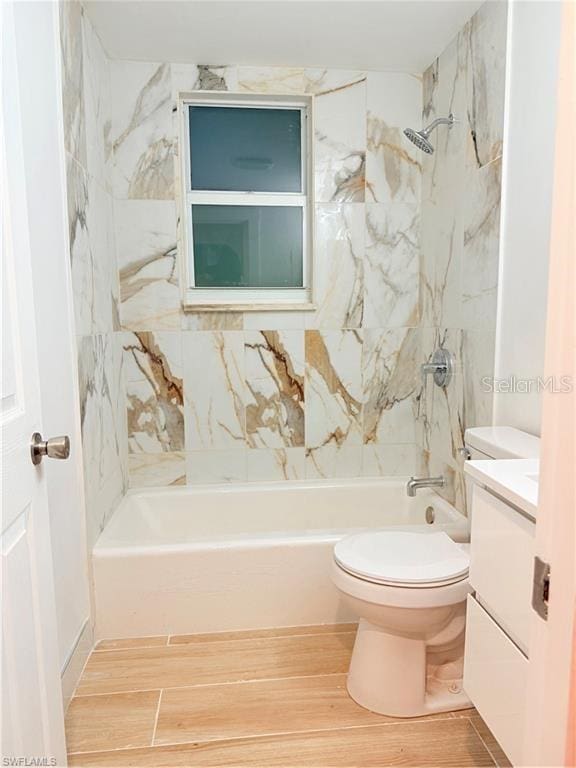 3902 Locust Ave, Sarasota, FL 34234 - bathroom with vanity, shower / bathtub combination, and wood finished floors