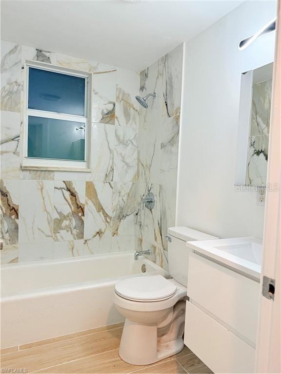 3902 Locust Ave, Sarasota, FL 34234 - full bathroom with vanity, wood finished floors, and shower / washtub combination