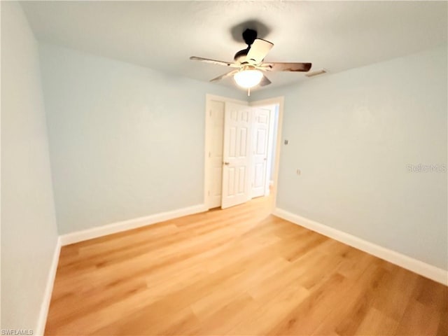 3902 Locust Ave, Sarasota, FL 34234 - spare room with ceiling fan and light wood-style floors