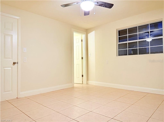 3902 Locust Ave, Sarasota, FL 34234 - empty room featuring light tile patterned floors and a ceiling fan