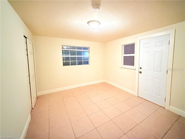 3902 Locust Ave, Sarasota, FL 34234 - spare room featuring light tile patterned floors and a smoke detector
